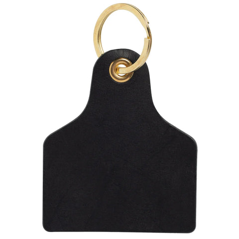 Handmade full-grain leather cattle tag keychain with antique brass keyring and hand-set brass eyelet, made by Rustic Oak Artisan Co. in Waller, Texas.